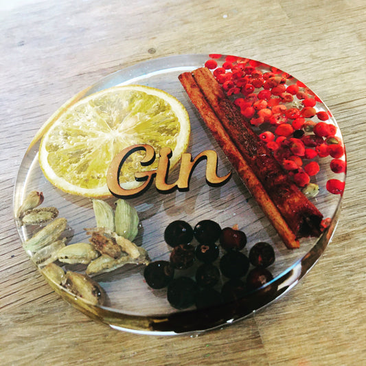 Gin botanicals coaster, cardamon, red peppercorns, juniper berries, cinnamon and orange encased in a coaster