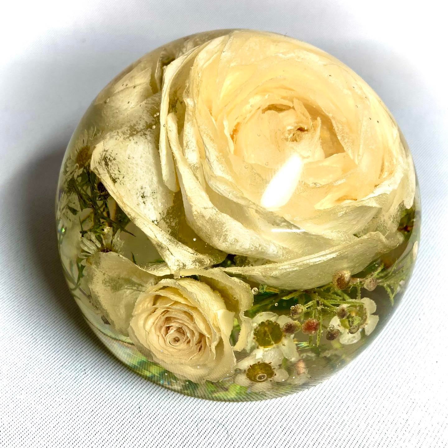 Preserve your memories of the special day with our beautiful Wedding Flowers Resin Sphere Paperweight. Handcrafted with love, our large resin spheres are perfect for showcasing your stunning wedding flowers in an elegant and unique way.