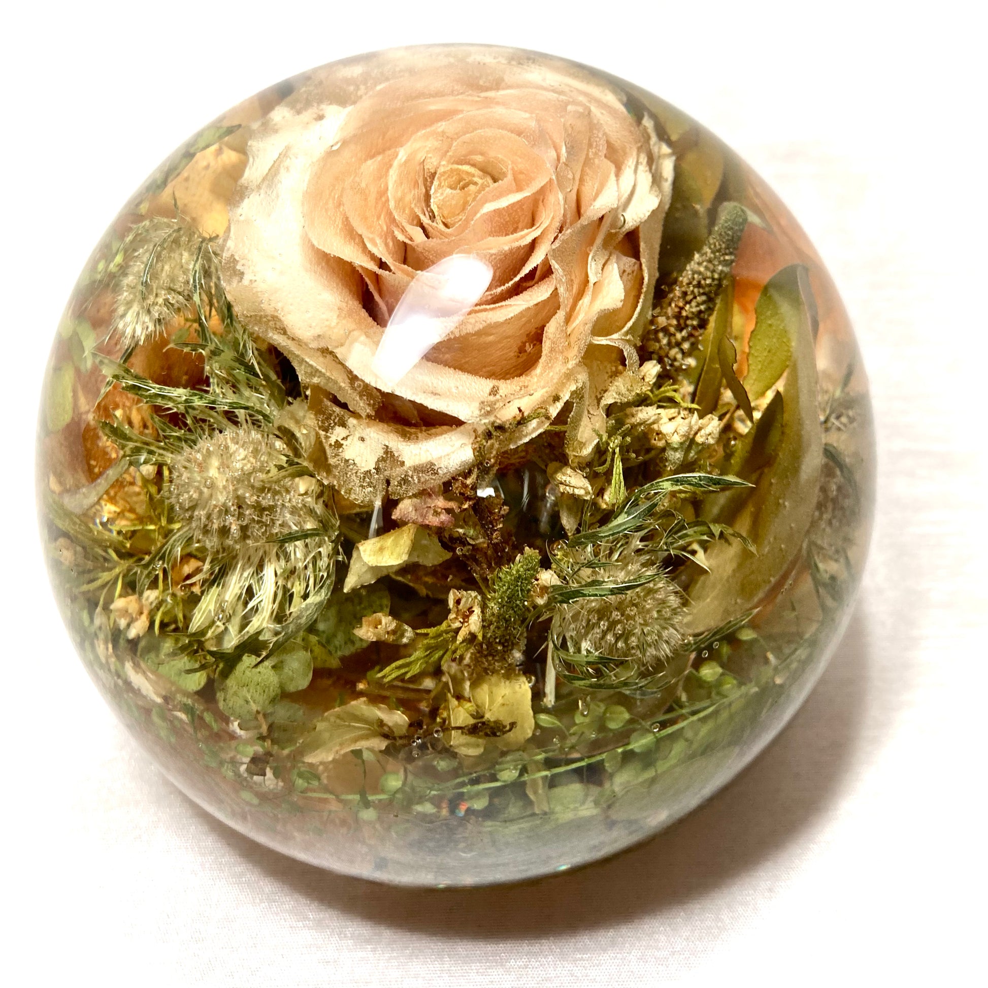 Preserve your memories of the special day with our beautiful Wedding Flowers Resin Sphere Paperweight. Handcrafted with love, our large resin spheres are perfect for showcasing your stunning wedding flowers in an elegant and unique way.
