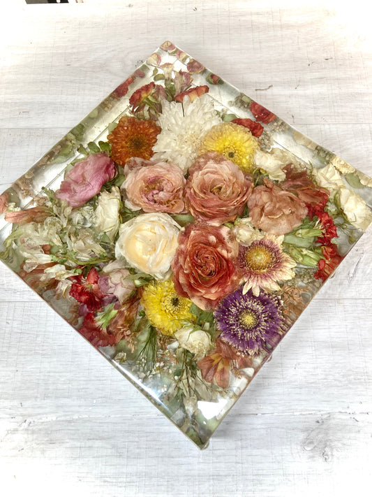 A beutiful 25cm resin display block containing a wedding bouquet 