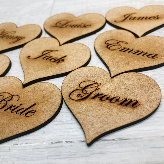 Heart shaped MDF place name with custom laser engraving for a special event.