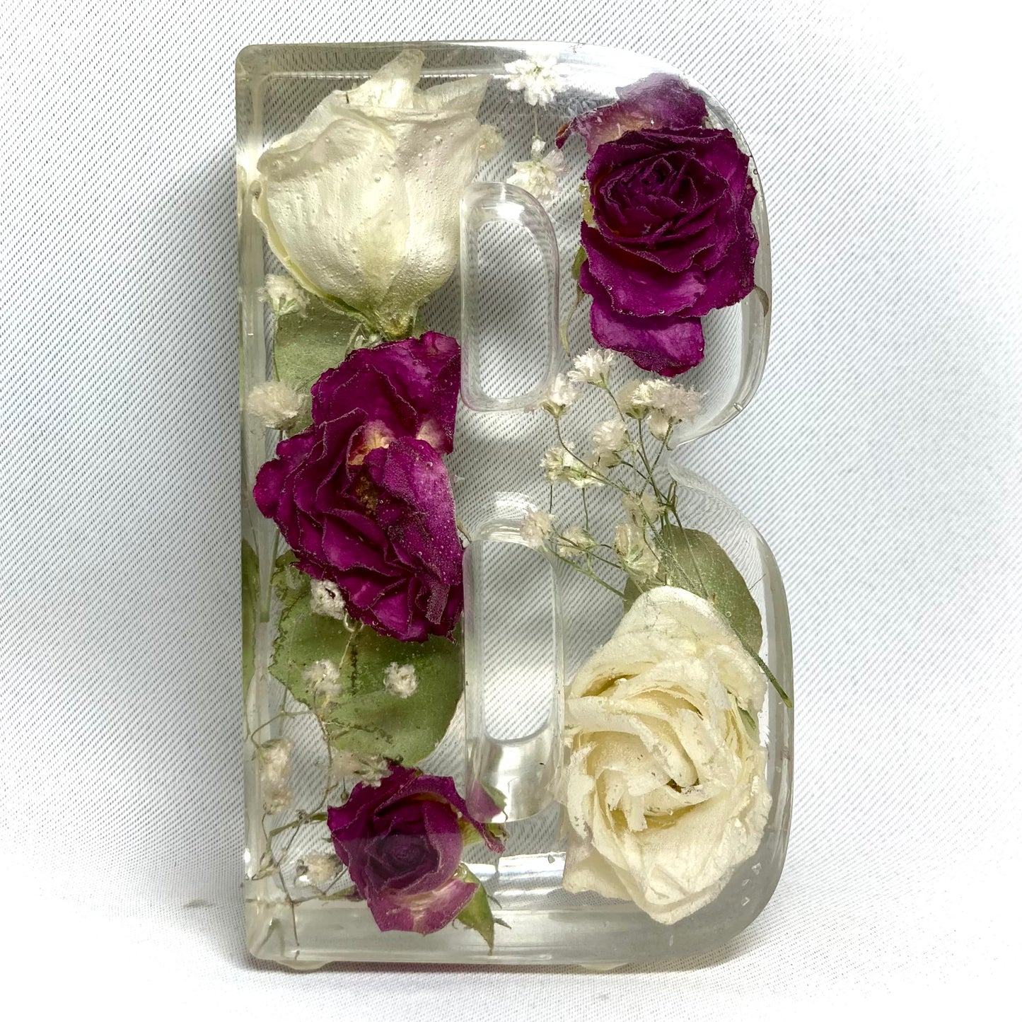 11cm freestanding letter B featuring pink spray roses, white lisianthus, gypsophila and eucalyptus
